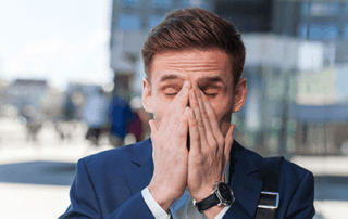 man sneezing